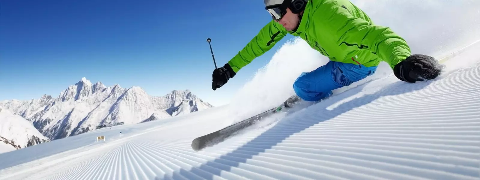 Skier on pise in high mountains