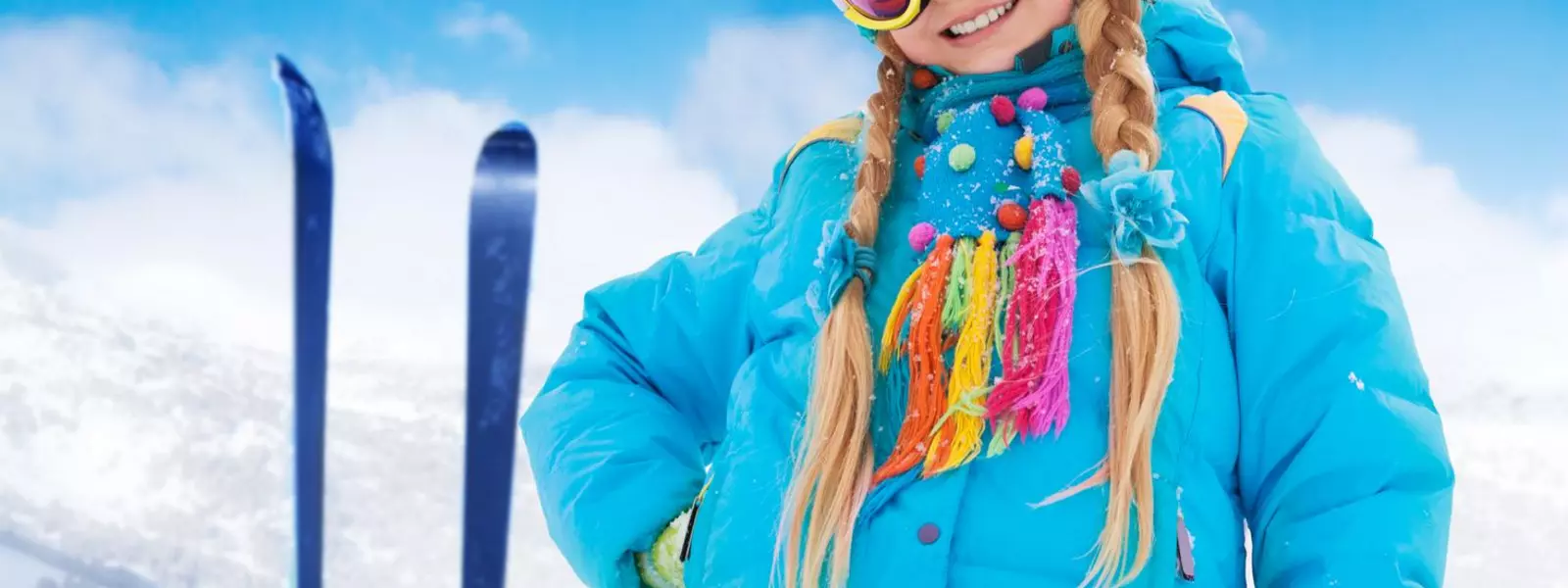 Happy girl with her mountain skis